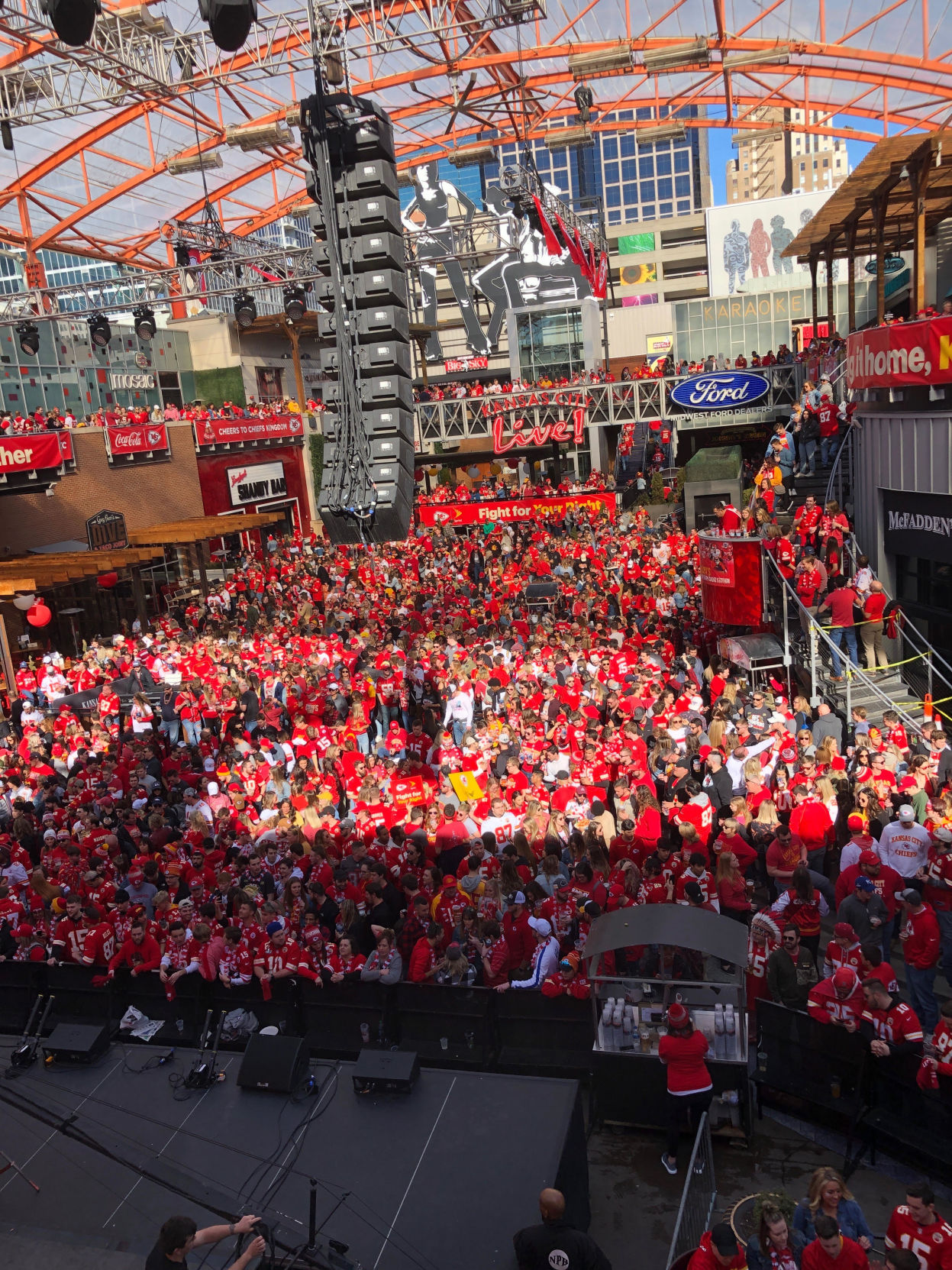 A sea of fans sporting Kansas City Chiefs apparel flood the Power and Light district in Kansas City